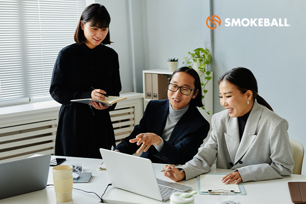 Women in suits in office setting.